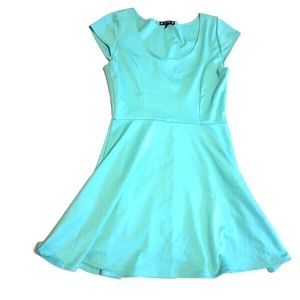 Try this mint green babydoll dress. Fitted stretch top. Flowy bottom. Se…